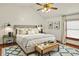 Cozy main bedroom featuring a comfortable bed, stylish rug, and ample natural light from the window at 785 Cottage Ln, Greenwood, IN 46143