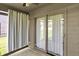 Bright sunroom featuring large windows and access to the backyard, providing seamless indoor-outdoor living at 785 Cottage Ln, Greenwood, IN 46143