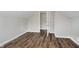 Finished attic space with hardwood floors, an open closet, and neutral paint at 8912 Robey Dr, Indianapolis, IN 46234
