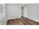 Inviting bedroom with wood-look floors and large window, providing plenty of natural light at 8912 Robey Dr, Indianapolis, IN 46234