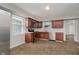 Updated kitchen with stainless steel appliances, wood cabinets, and ample counter space at 8912 Robey Dr, Indianapolis, IN 46234