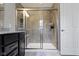 Bathroom featuring glass-enclosed shower, granite vanity, and tile flooring at 9476 Oakley Dr, Indianapolis, IN 46260