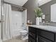 Bathroom features granite countertops, dark cabinetry, and tiled flooring at 9476 Oakley Dr, Indianapolis, IN 46260
