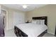 This bedroom features a ceiling fan and a closet with white doors at 9476 Oakley Dr, Indianapolis, IN 46260