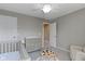 Bedroom featuring a changing table, play table, and crib at 9476 Oakley Dr, Indianapolis, IN 46260