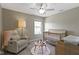 Inviting Bedroom with a comfortable chair and crib at 9476 Oakley Dr, Indianapolis, IN 46260