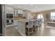 Bright kitchen featuring an island with bar stool seating, stainless appliances, and an open layout at 9476 Oakley Dr, Indianapolis, IN 46260