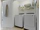 Bright laundry room with modern front loading washer and dryer at 9476 Oakley Dr, Indianapolis, IN 46260