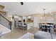 Open living space featuring an island kitchen, dining area, and living room area at 9476 Oakley Dr, Indianapolis, IN 46260
