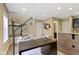 Open office area showcasing a desk, stairs, bar, and neutral wall color at 9476 Oakley Dr, Indianapolis, IN 46260