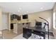 Office and bar area featuring modern desk, cabinetry, and mounted TV at 9476 Oakley Dr, Indianapolis, IN 46260