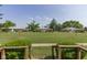 View of backyard, featuring park-like setting, lush green grass, and mature trees at 951 W Mckay Rd, Shelbyville, IN 46176