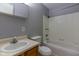 Functional bathroom featuring a combined shower and tub unit, simple vanity, and essential fixtures at 951 W Mckay Rd, Shelbyville, IN 46176