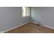 Simple bedroom with neutral carpet, a window providing natural light, and a minimalist aesthetic at 951 W Mckay Rd, Shelbyville, IN 46176