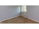 Cozy bedroom featuring a window for natural light and soft carpet flooring at 951 W Mckay Rd, Shelbyville, IN 46176