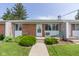 Charming brick apartment with well-maintained landscaping, inviting front entry, and manicured lawn at 951 W Mckay Rd, Shelbyville, IN 46176