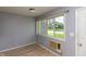Bright living room featuring a large window offering plenty of natural light and grey walls at 951 W Mckay Rd, Shelbyville, IN 46176