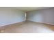 Expansive living room with neutral carpet and ample space for furniture arrangement at 951 W Mckay Rd, Shelbyville, IN 46176