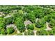 An impressive home sits amid a lush landscape with manicured lawns and mature trees at 9690 Irishmans Run Ln, Zionsville, IN 46077