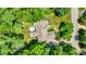 Bird's-eye view showcases the home's architectural roof design and landscaped yard at 9690 Irishmans Run Ln, Zionsville, IN 46077