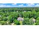 Aerial view of neighborhood featuring homes in a wooded area at 9690 Irishmans Run Ln, Zionsville, IN 46077