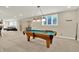 Finished basement area featuring a pool table, seating area and wet bar at 9690 Irishmans Run Ln, Zionsville, IN 46077