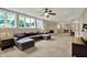 Spacious finished basement with large windows, neutral carpet, a pool table, a wet bar, and a comfortable seating area at 9690 Irishmans Run Ln, Zionsville, IN 46077