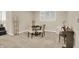 Finished basement area featuring a piano and a table with four chairs at 9690 Irishmans Run Ln, Zionsville, IN 46077