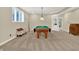 Finished basement area featuring a pool table, window, and a bench at 9690 Irishmans Run Ln, Zionsville, IN 46077
