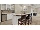 Close up of a wet bar in finished basement with tile floors and seating at 9690 Irishmans Run Ln, Zionsville, IN 46077