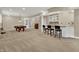 Finished basement featuring neutral carpet, a wet bar with seating, and a pool table at 9690 Irishmans Run Ln, Zionsville, IN 46077