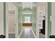 Ensuite bathroom with tiled floors, tub, and dual walk-in closets at 9690 Irishmans Run Ln, Zionsville, IN 46077