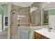 Bathroom featuring a glass-enclosed shower, vanity, and tile flooring at 9690 Irishmans Run Ln, Zionsville, IN 46077