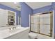 Updated bathroom with walk-in shower and white vanity at 9690 Irishmans Run Ln, Zionsville, IN 46077