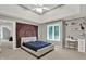 This bedroom features a modern tray ceiling, a bright window, and ample space for relaxation and personalization at 9690 Irishmans Run Ln, Zionsville, IN 46077