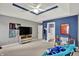 Spacious bedroom featuring accent wall, built-ins, and en suite bathroom at 9690 Irishmans Run Ln, Zionsville, IN 46077