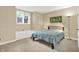 Cozy bedroom with ample natural light from the window and stylish furnishings at 9690 Irishmans Run Ln, Zionsville, IN 46077