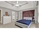 This bedroom showcases a tray ceiling, neutral walls, and access to the bathroom and closet at 9690 Irishmans Run Ln, Zionsville, IN 46077