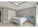 Cozy bedroom featuring a metal bed frame, neutral decor, and ample natural light at 9690 Irishmans Run Ln, Zionsville, IN 46077