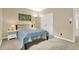 Bedroom with neutral paint, natural lighting, and a view to the hallway at 9690 Irishmans Run Ln, Zionsville, IN 46077