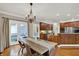Formal dining room with hardwood floors, chandelier, and outdoor access at 9690 Irishmans Run Ln, Zionsville, IN 46077