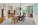 Open concept dining room features natural light, elegant chandelier, and is open to the foyer creating an inviting and open feel at 9690 Irishmans Run Ln, Zionsville, IN 46077