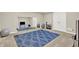 Bright exercise room featuring a large mirror, plenty of storage, and natural light at 9690 Irishmans Run Ln, Zionsville, IN 46077
