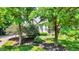 Beautiful home with a well-manicured lawn and trees surrounding the property at 9690 Irishmans Run Ln, Zionsville, IN 46077