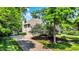 Beautiful home with a manicured lawn and a long driveway at 9690 Irishmans Run Ln, Zionsville, IN 46077