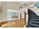 Bright foyer showcases staircase and entry into the dining room, creating an inviting and open feel at 9690 Irishmans Run Ln, Zionsville, IN 46077