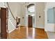 Grand foyer with high ceilings, hardwood floors, and a elegant staircase creating a welcoming entrance at 9690 Irishmans Run Ln, Zionsville, IN 46077