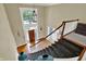 Grand two story foyer and staircase with natural light from large windows at 9690 Irishmans Run Ln, Zionsville, IN 46077