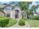 Elegant stone-clad home with well-maintained landscaping and a grand entrance, perfect for welcoming guests at 9690 Irishmans Run Ln, Zionsville, IN 46077