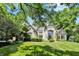 A stately home with lush landscaping, offering a serene and private setting, perfect for luxury living at 9690 Irishmans Run Ln, Zionsville, IN 46077